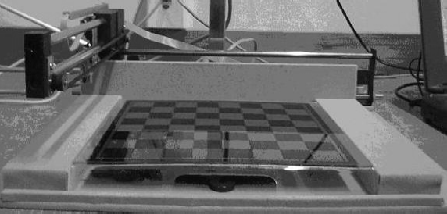 move, the human opponent has to place their hand under the camera to move a piece. This usually obscures some of the pieces detected by the vision system. Therefore, valid images must be identified.