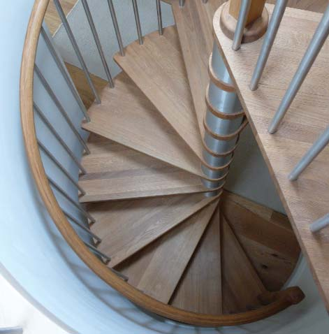 Bottom right: Looking down on a Model 71 Spiral with oak treads and handrail.