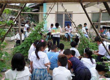 THE HEALING GARDEN PROJECT Sharing stories under the garden's bamboo arch good mornings each time I entered the classroom. The children were well-behaved, quiet, and eager to listen.