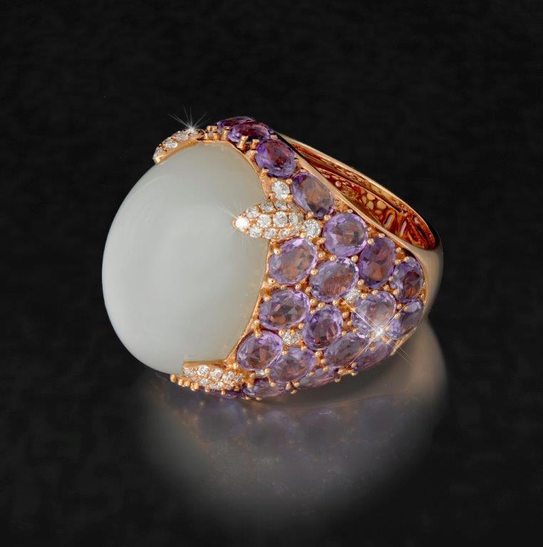 Exceptional ring 11 One spectacular ring, 18 karat rose gold weighing 13.1 grams, set with center moon stone with a carat weight of 26.95 ct.