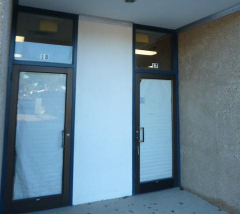 BUILDING CONDITION: EXTERIOR Walkway leading to building exhibit has numerous cracks. Residue build up on walls. Typical control joint condition.