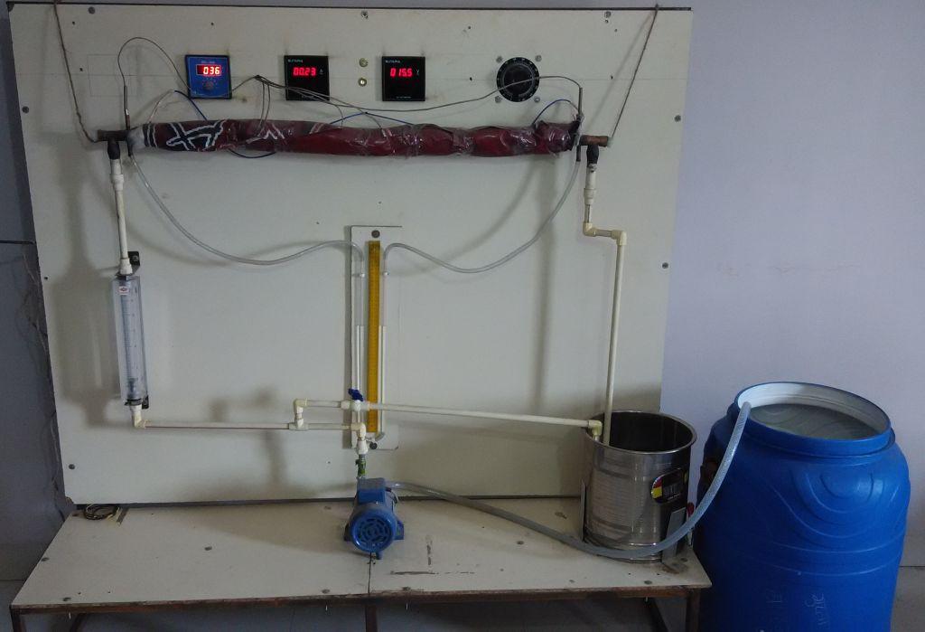 placed at the inlet and one thermocouple was placed at outlet to measure the inlet and outlet bulk temperatures, respectively. Manometer was used to measure the pressure drop within the tested tube.
