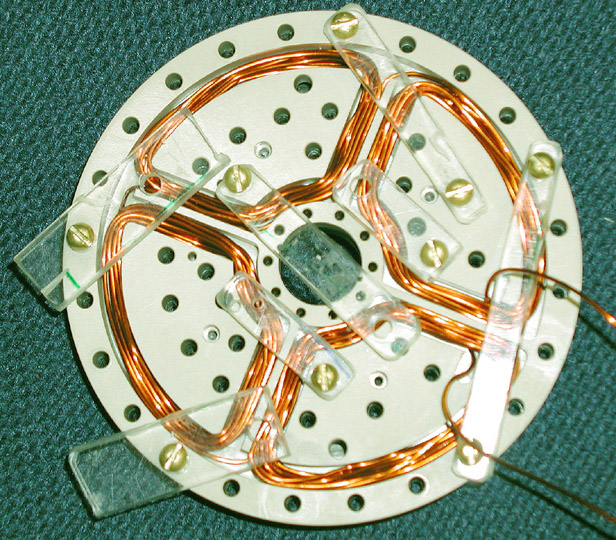 34 Figure 2.11 Photograph of the quadrupole coils during construction. is no hardened wood glue on any of the sealing surfaces.